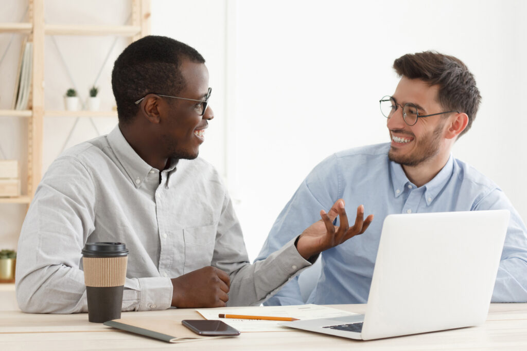 An experienced employee giving career advice for young professional.