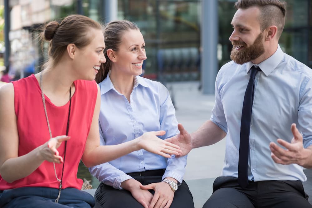 A sales professional talking to the prospects using conversation starters.